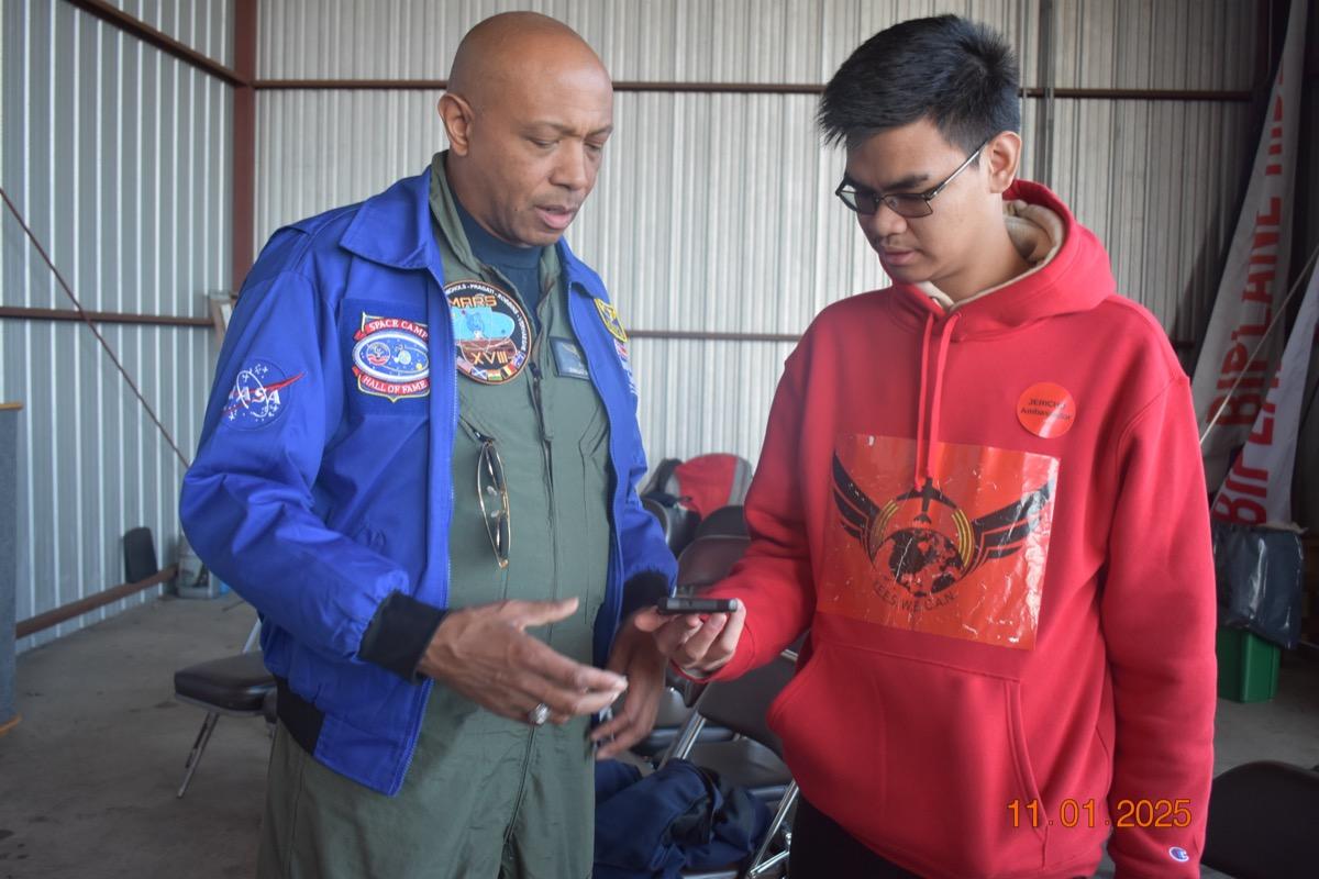 Diallo Wallace mentoring YES WE CAN student at Shades of Blue event